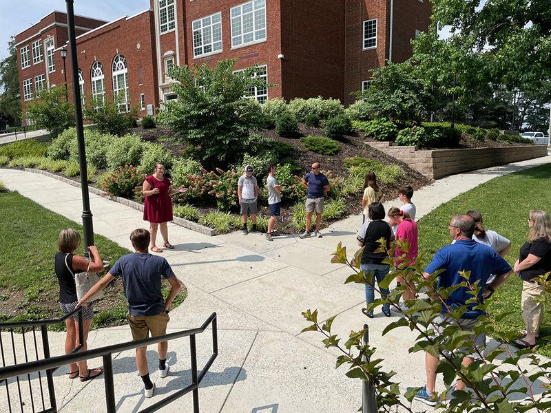 photo of families on a campus tour gathered in front of GSB